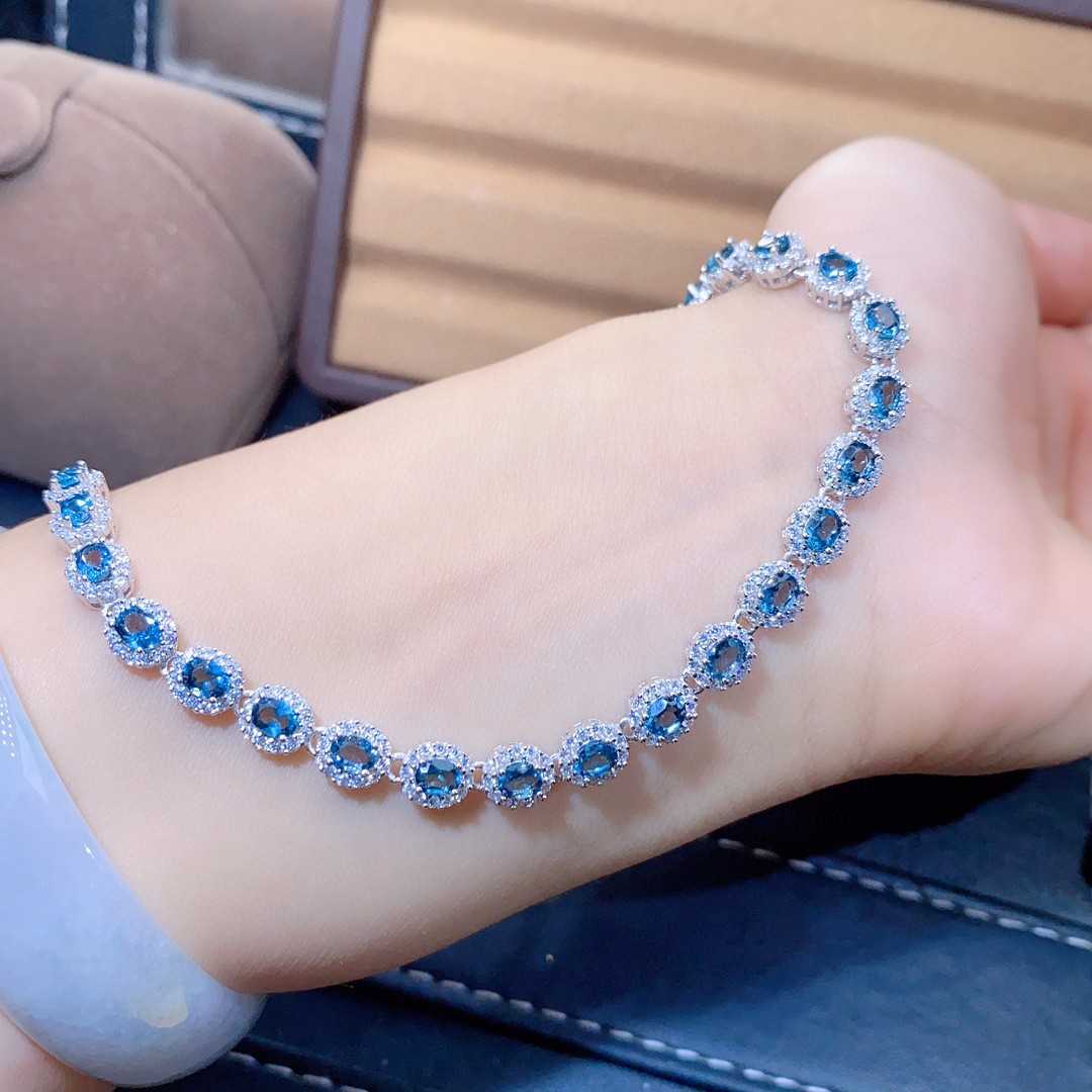 Blue Topaz Halo Tennis Bracelet | Sterling Silver