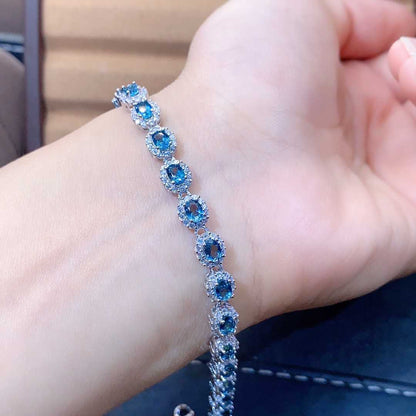 Blue Topaz Halo Tennis Bracelet | Sterling Silver