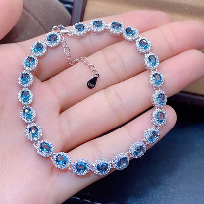 Blue Topaz Halo Tennis Bracelet | Sterling Silver